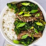 Air fried beef and broccoli in a bowl served over rice.