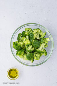 broccoli in a bowl with olive oil.