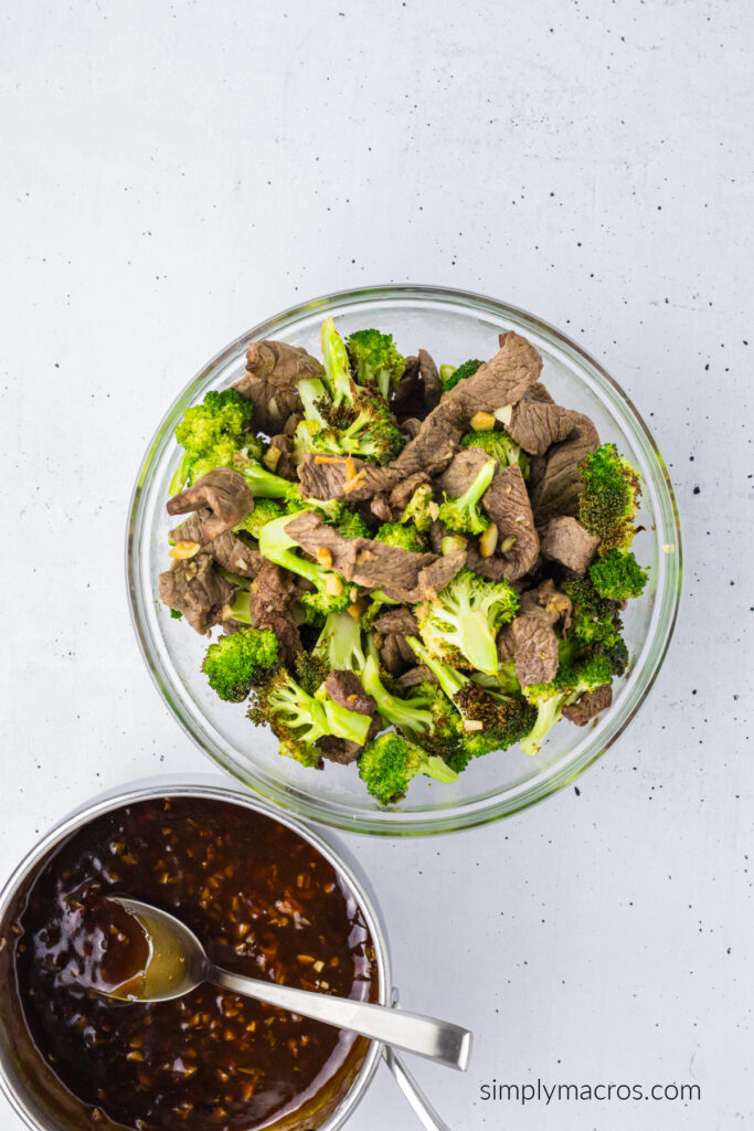 Cooked beef and broccoli and a bowl of the marinade to be mixed together. 