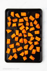 sweet potatoes roasted in the oven and on a baking sheet.