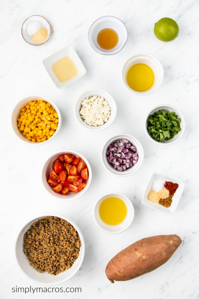 Ingredients needed to make quinoa sweet potato bowls on a white table top.