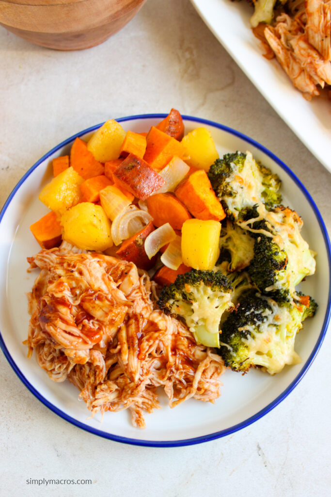 Sheet pan bbq chicken and veggoes on a plate and ready to serve. 