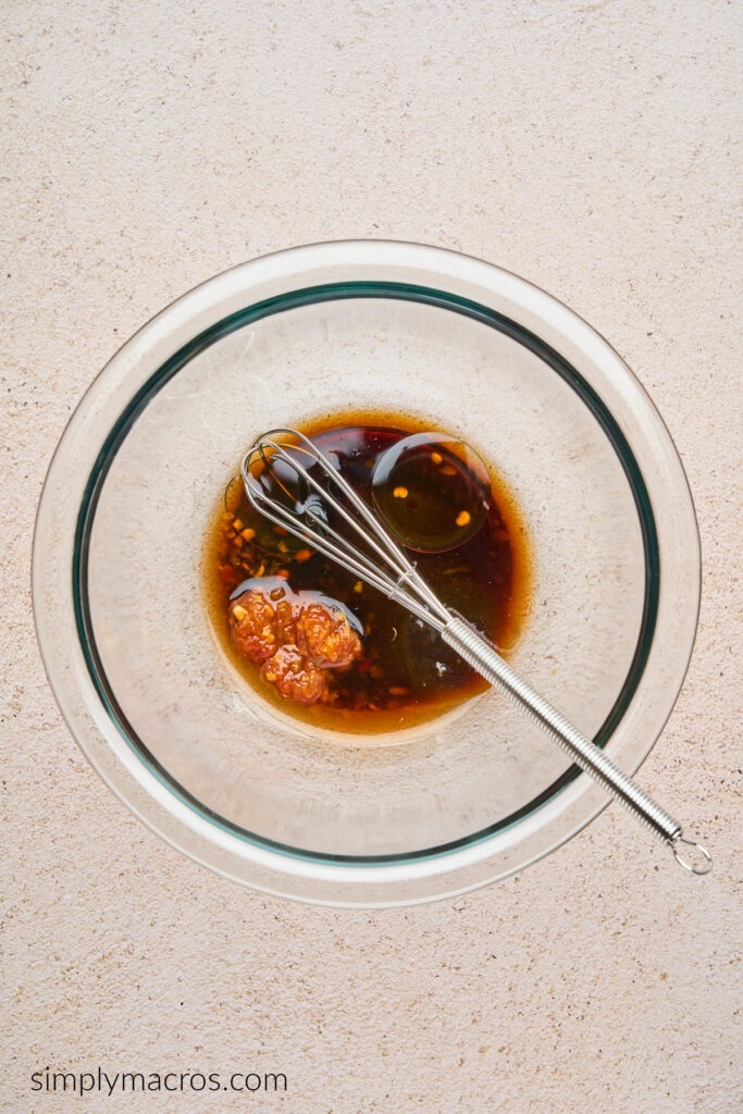 A small bowl with the soy sauce, hoisin sauce, chili paste, toasted sesame oil, and rice vinegar.