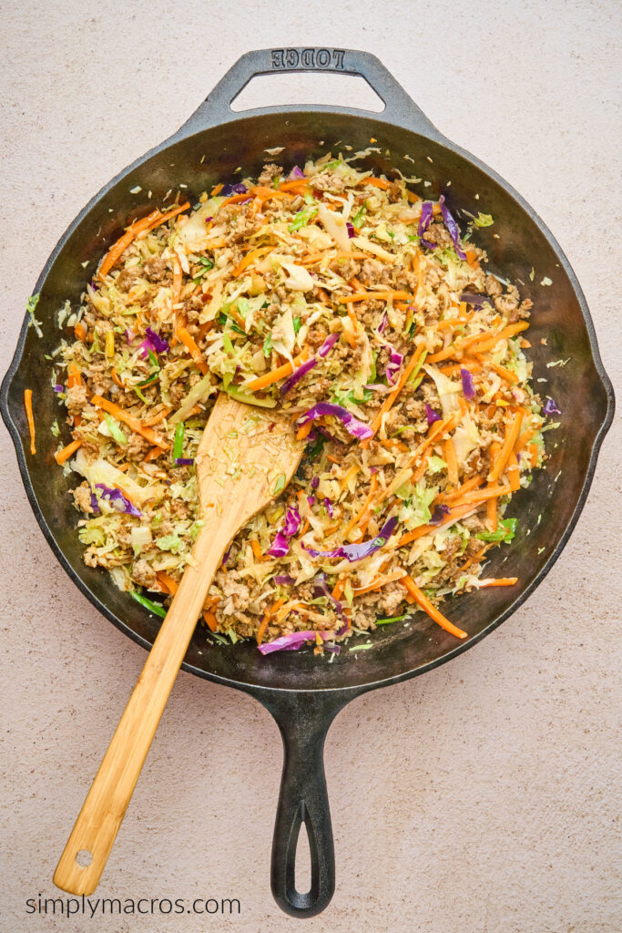 Egg roll in a bowl in the skillet, ready to serve. 