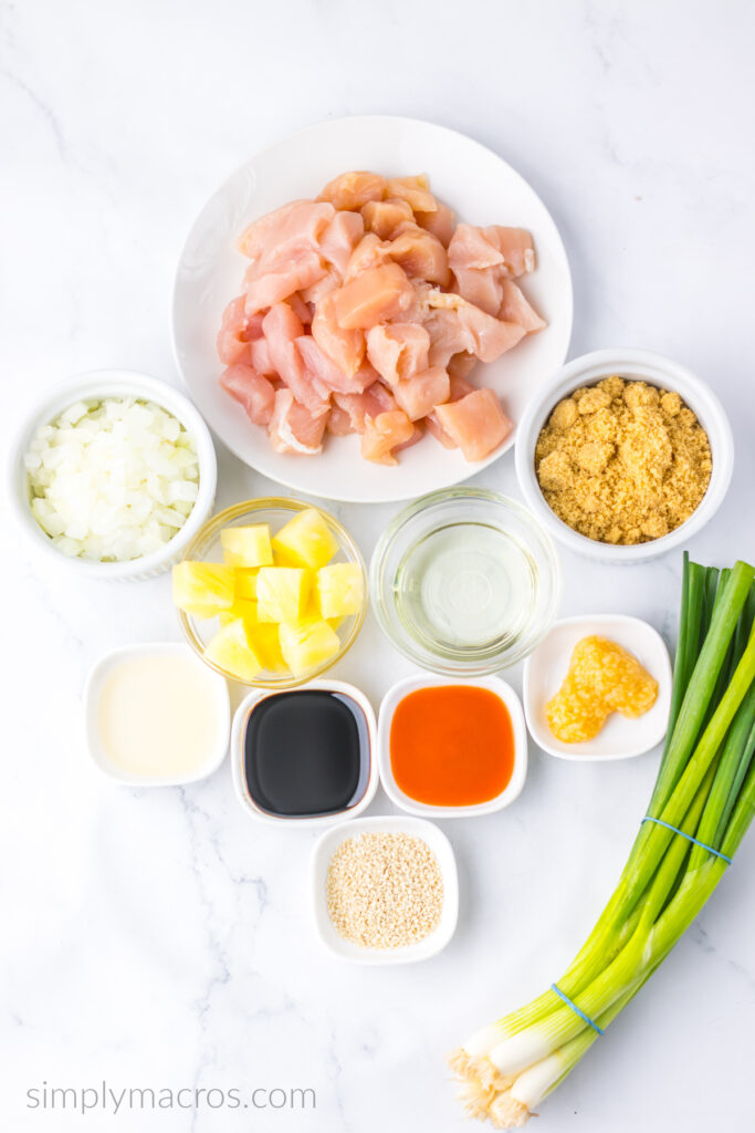 Ingredients needed for brown sugar pineapple chicken measured and placed into bowls, ready to cook. 