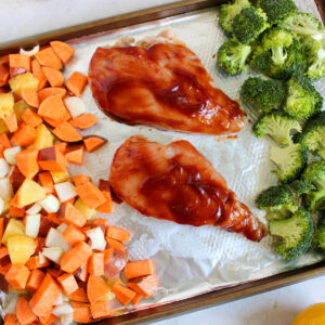 BBQ Chicken and veggies on a sheet pan.