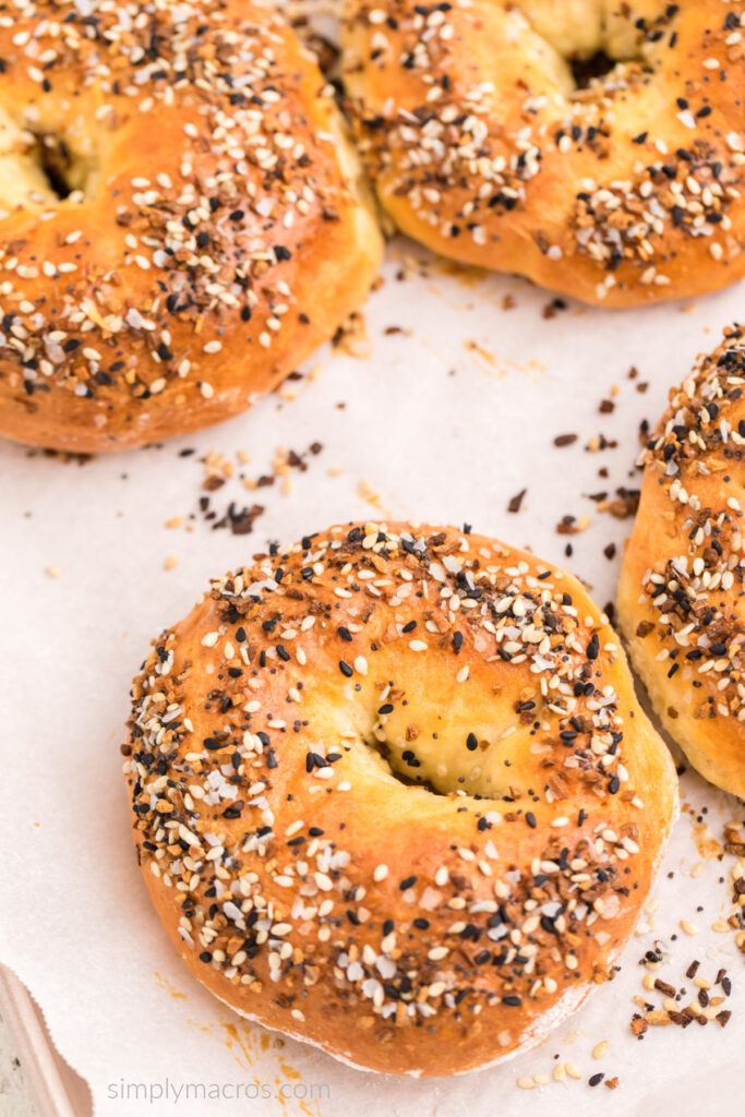 3 Ingredient cottage cheese bagels with everything bagel seasoning on top, on a baking sheet, ready to eat. 