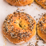 Close up photo of a cottage cheese bagel, ready to eat.