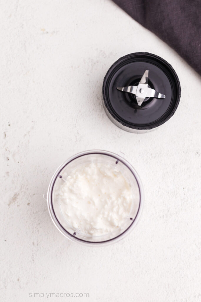 Cottage cheese in a blender, ready to be blended and smoothed. 