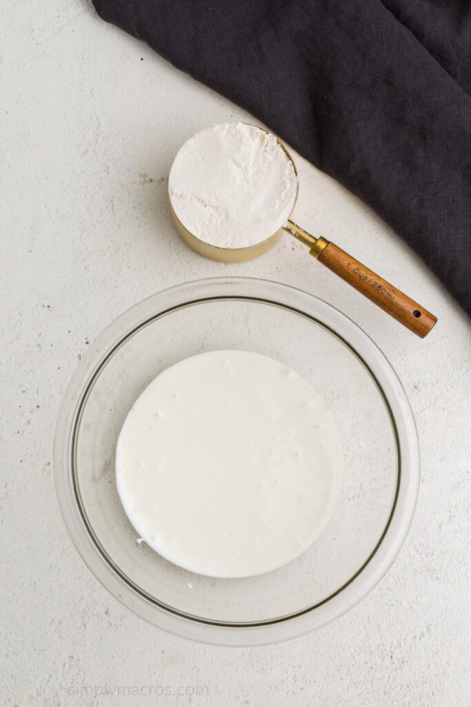 Blended Cottage cheese in a bowl with the flour ready to be added. 