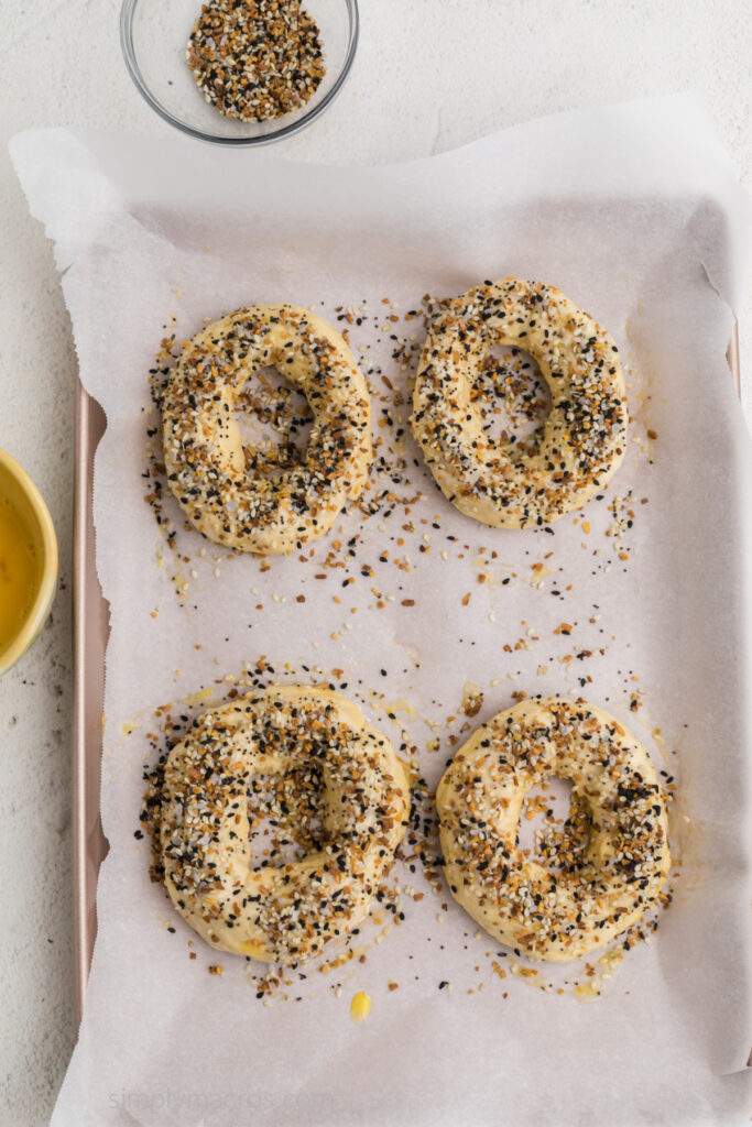 Dough brushed with egg on top and then sprinkled with bagel seasoning. 