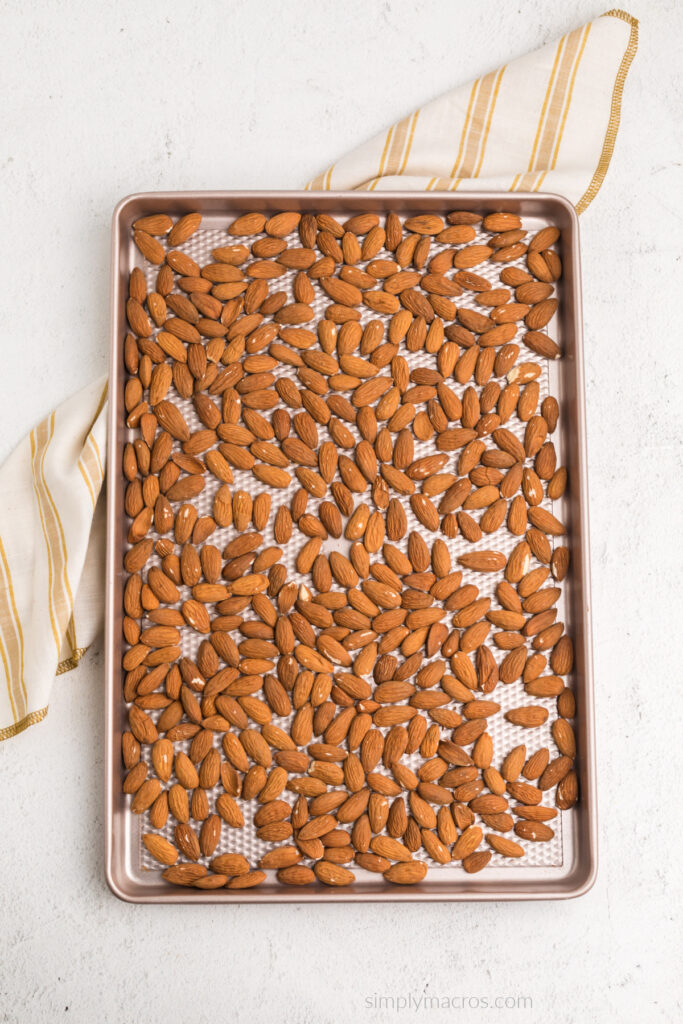 Roasted almonds on a cookie sheet. 