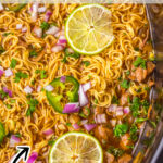 Close up of cooked birria ramen in a slow cooker. Pinnable image.