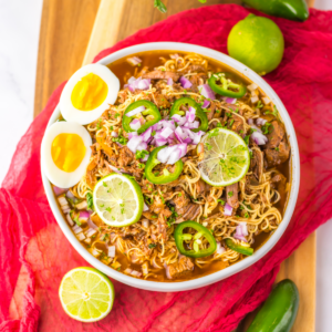 Slow cooker birria ramen in a bowl, ready to eat.