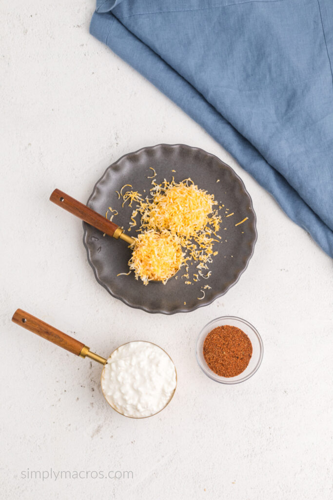 Cottage cheese, cheddar jack cheese, and taco seasoning used to make cottage cheese queso.