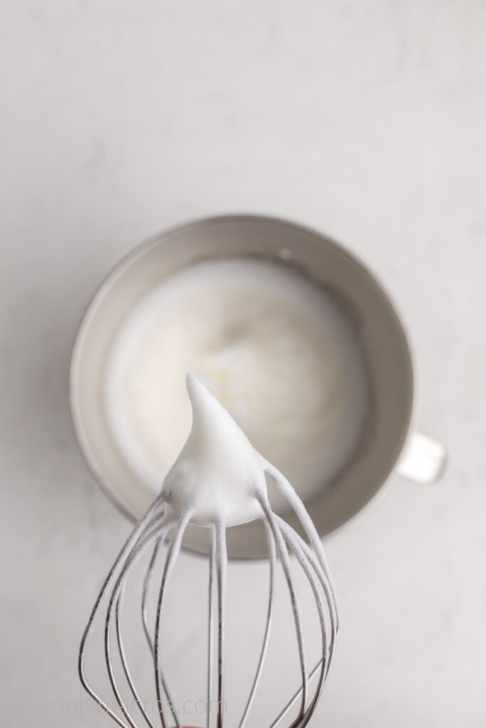 Egg whites and cream of tartar mixed until they've created meringue with stiff peaks. 