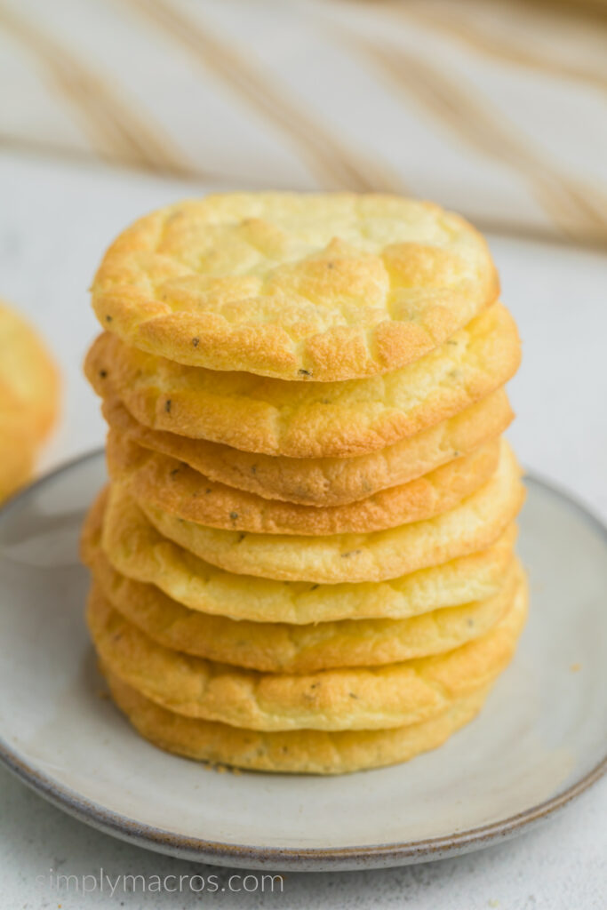 Close up image of cloud bread stacked on a white plate, ready to serve. 