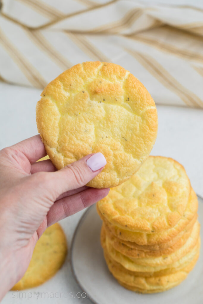 Hand holding a piece of cloud bread, ready to eat. 