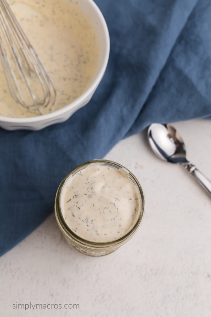 Overhead photo of low calorie ranch dressing in a jar. 