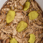 Slow cooker Mississippi chicken ready to serve. Pinnable image.