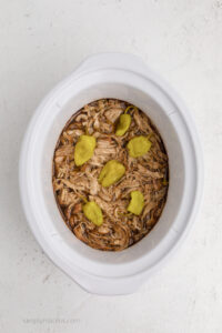 Mississippi chicken shredded in the slow cooker.