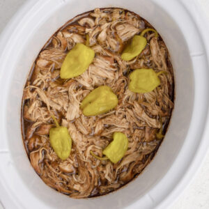 Overhead photo of Mississippi chicken in the slow cooker, ready to serve.