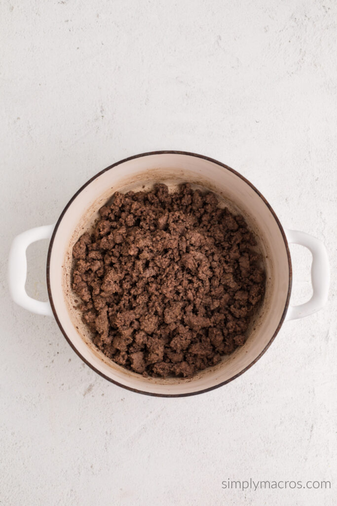 Lean ground beef cooked and drained in a deep skillet. 