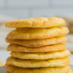 Zero carb cloud bread stacked on a plate, pinnable image.