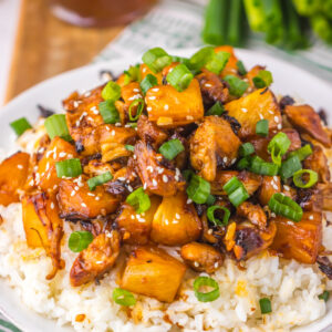 Brown sugar pineapple chicken over a bed of rice, ready to eat.