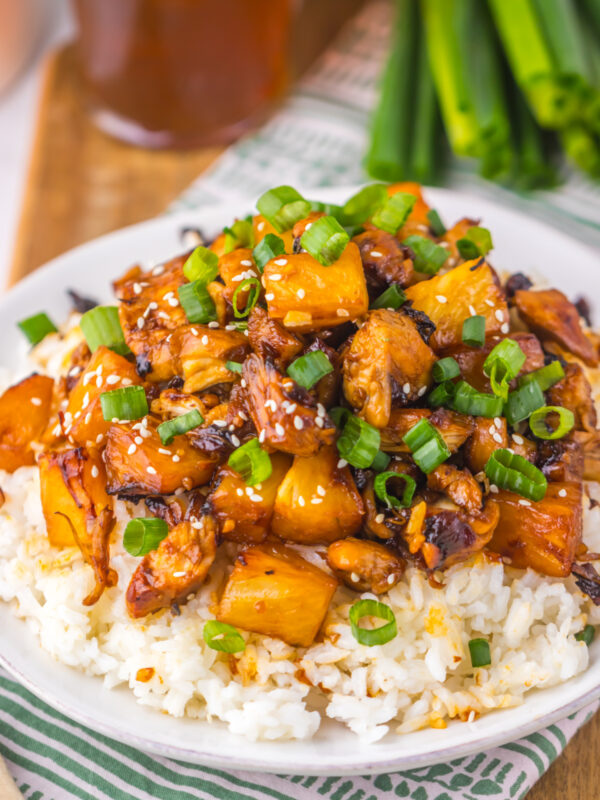 Brown sugar pineapple chicken over a bed of rice, ready to eat.