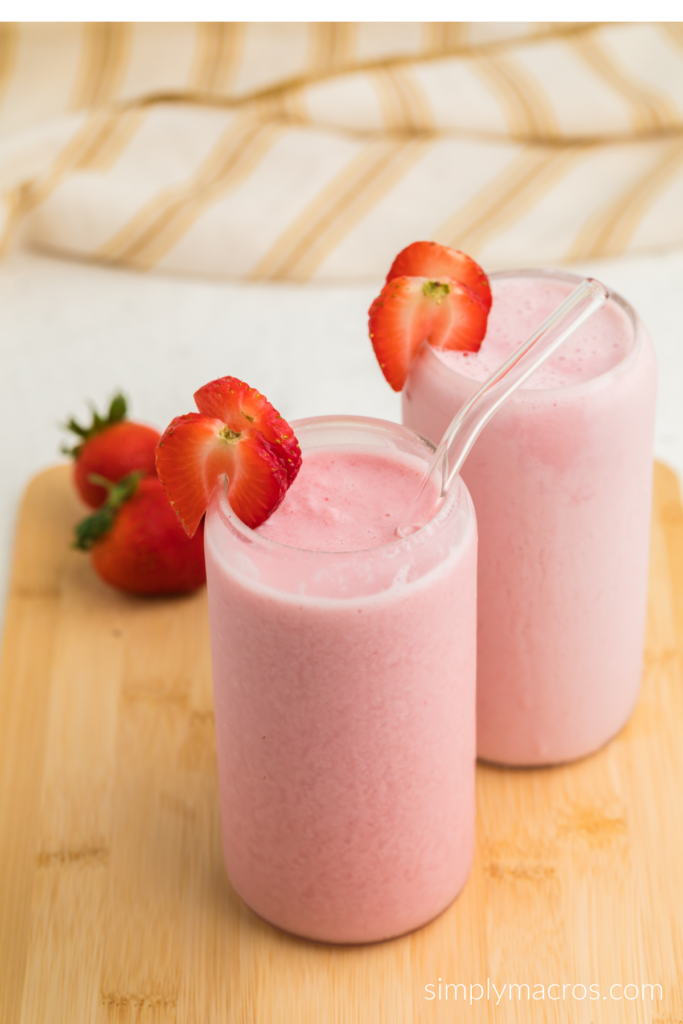 Strawberry cottage cheese smoothies on a board ready to serve.