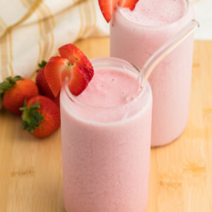 Photo of strawberry cottage cheese smoothies on a board and ready to serve.