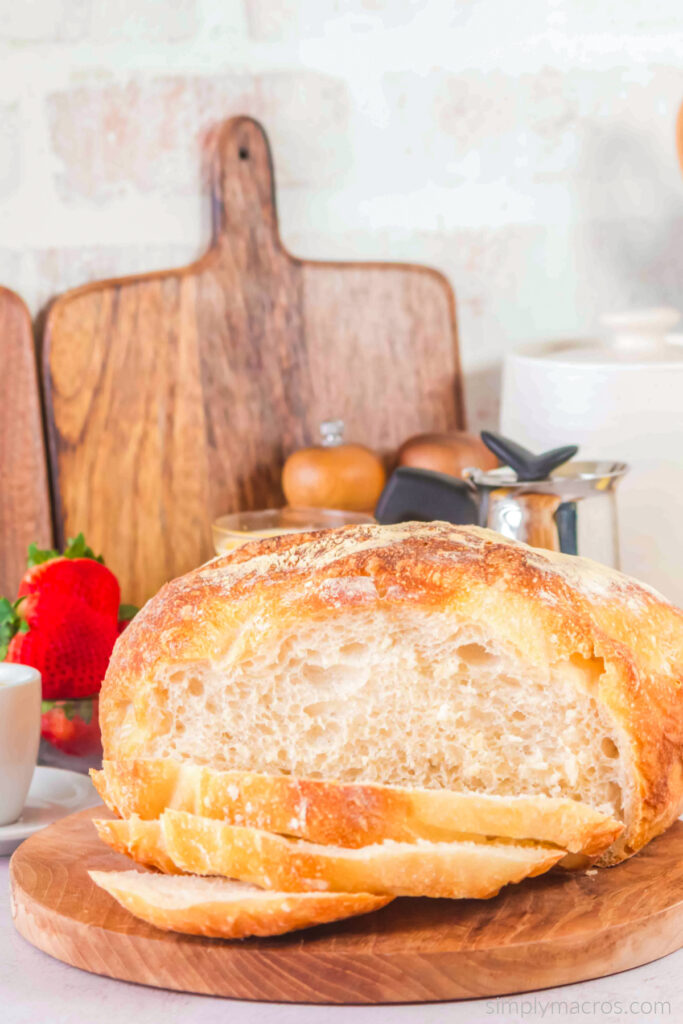 Sourdough bread sliced on a cutting board and ready to serve.