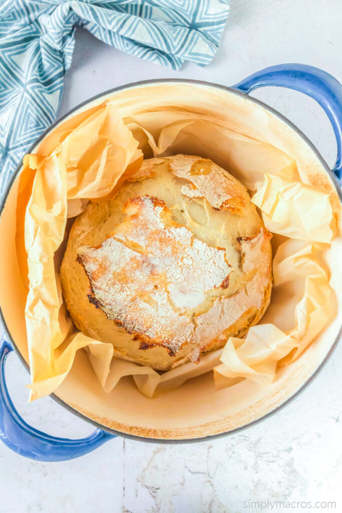 Sourdough bread baking inside of a dutch oven. 