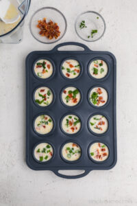 veggies and bacon sprinkled over the egg white bites.