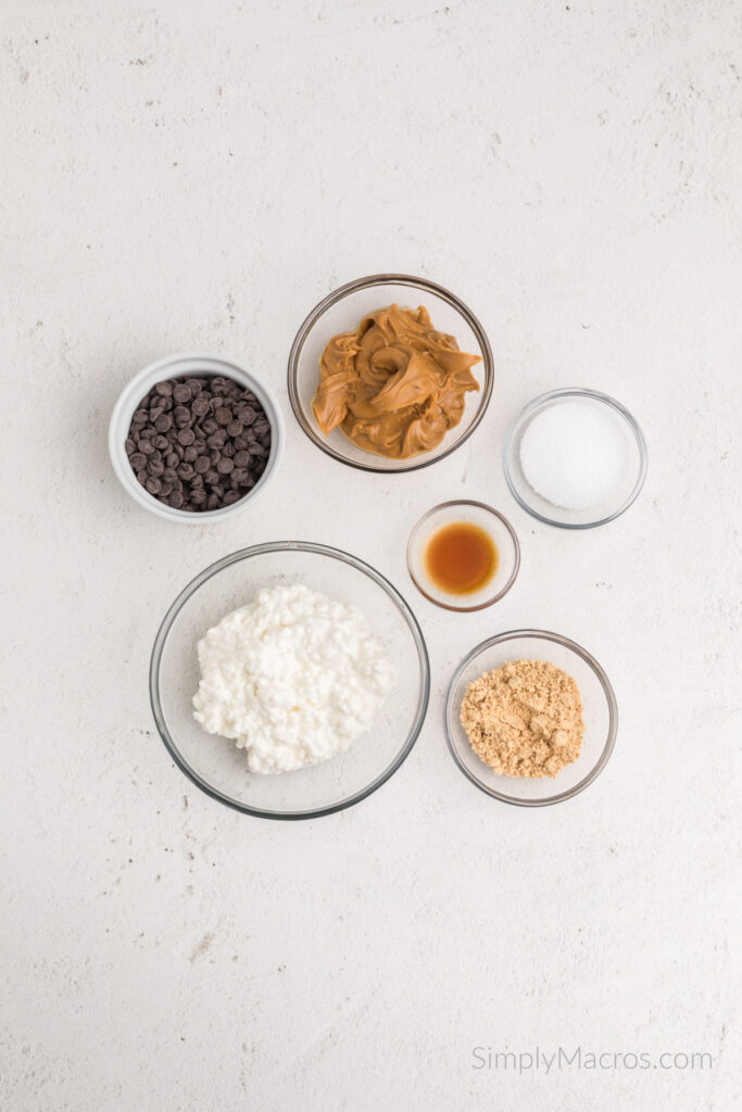 Ingredients needed to make high protein peanut butter balls on a table. 