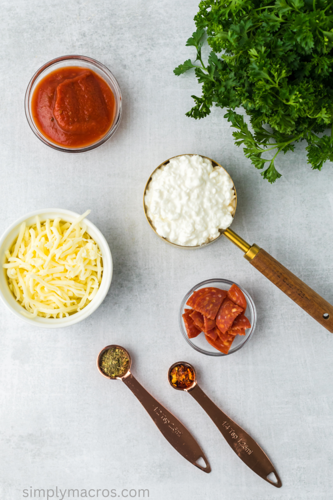 Ingredients needed to make a cottage cheese pizza bowl, separated and ready to use.