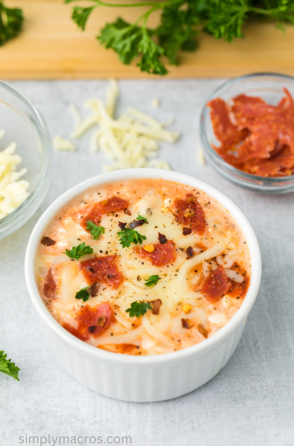 Close up of a cottage cheese pizza bowl, ready to eat.