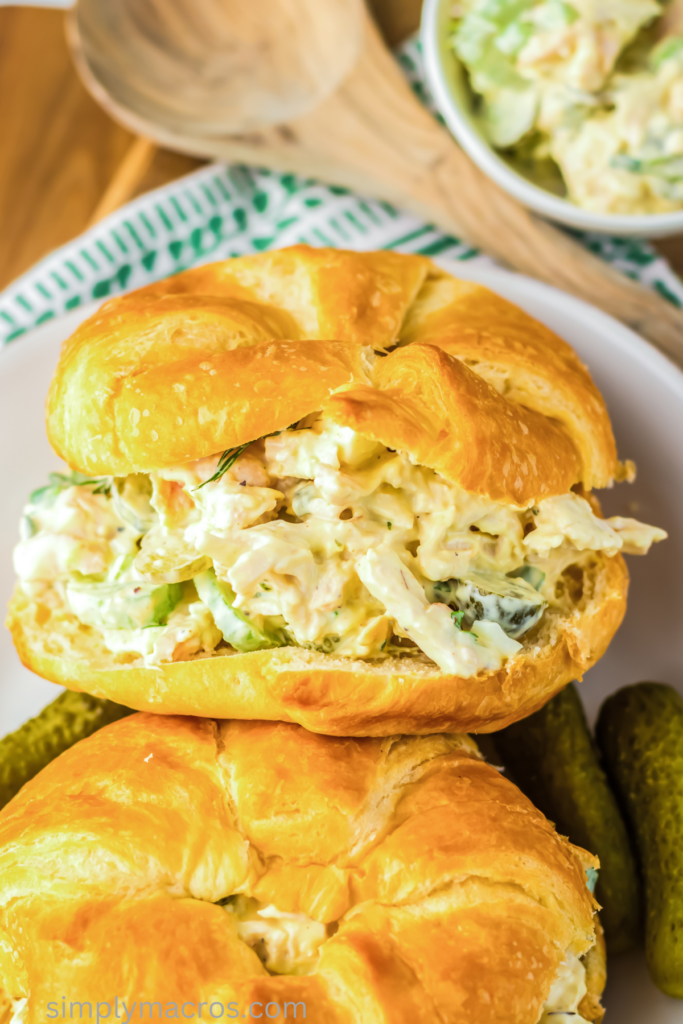 Dill pickle chicken salad on a croissant, ready to eat. 