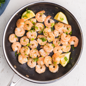 Overhead shot of easy lemon garlic shrimp in a skillet.