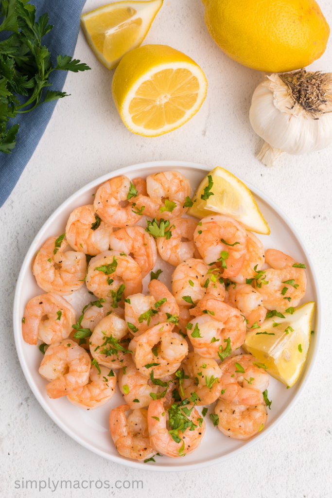 Plate of lemon garlic shrimp topped with fresh parsley, ready to serve.