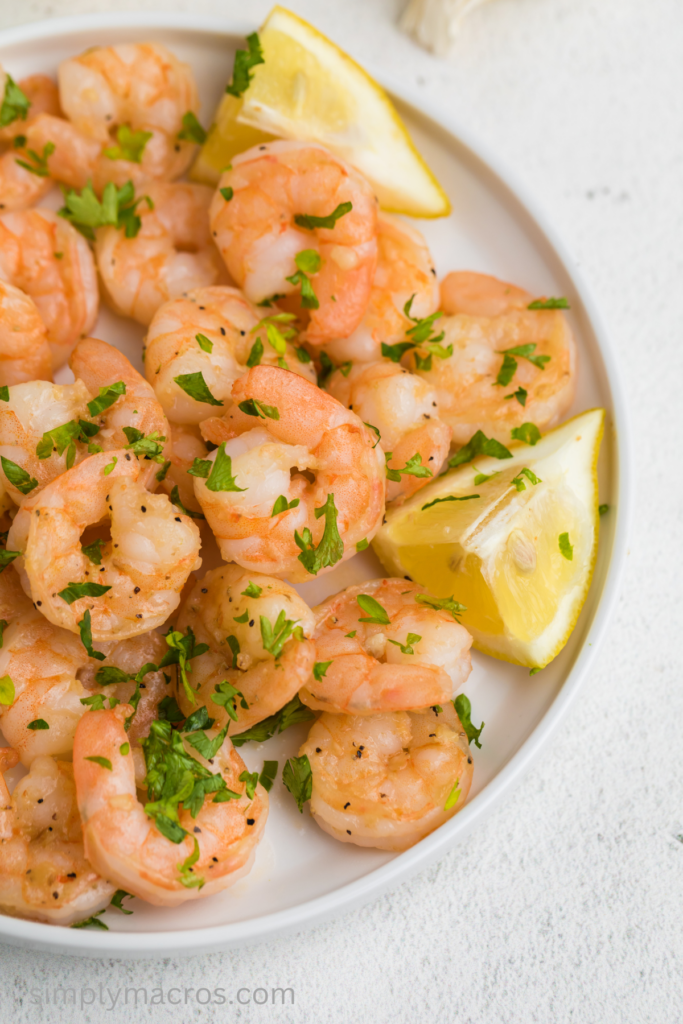 Close up of a plate of lemon garlic shrimp, ready to serve. 