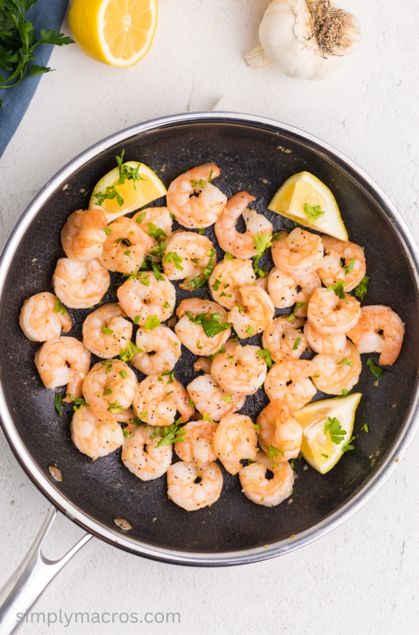 Overhead photo of fully cooked lemon garlic shrimp in a skillet.