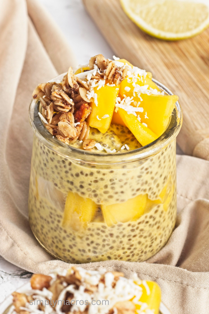 CLose up of mango chia seed pudding, topped with toppings and ready to serve.