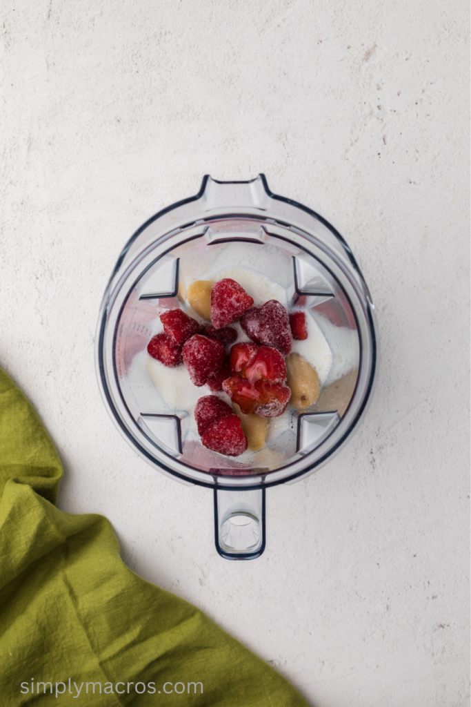 frozen strawberries, bananas, milk, and honey in a blender. 