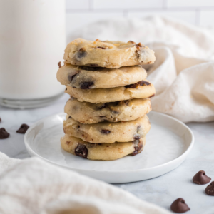 Stack of cottage cheese chocolate chip cookies on a plate.