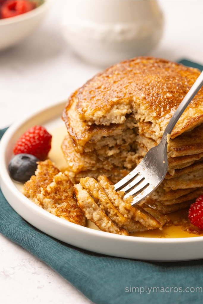 Bite of pancakes on a fork. 