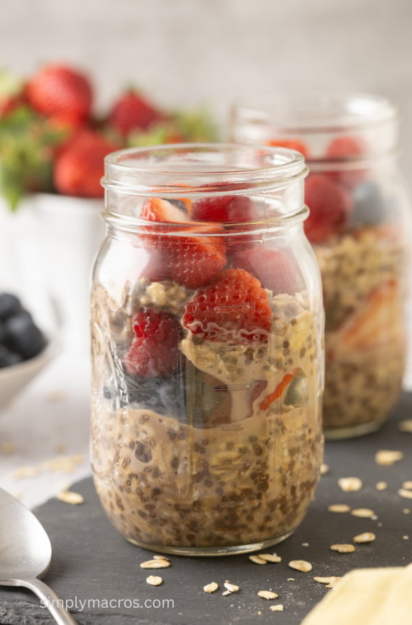 Jars of mixed berry overnight oats, ready to serve.