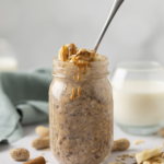 Spoon in a jar of peanut butter and banana overnight oats.