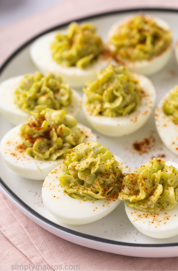 Avocado deviled eggs on a plate, ready to serve.